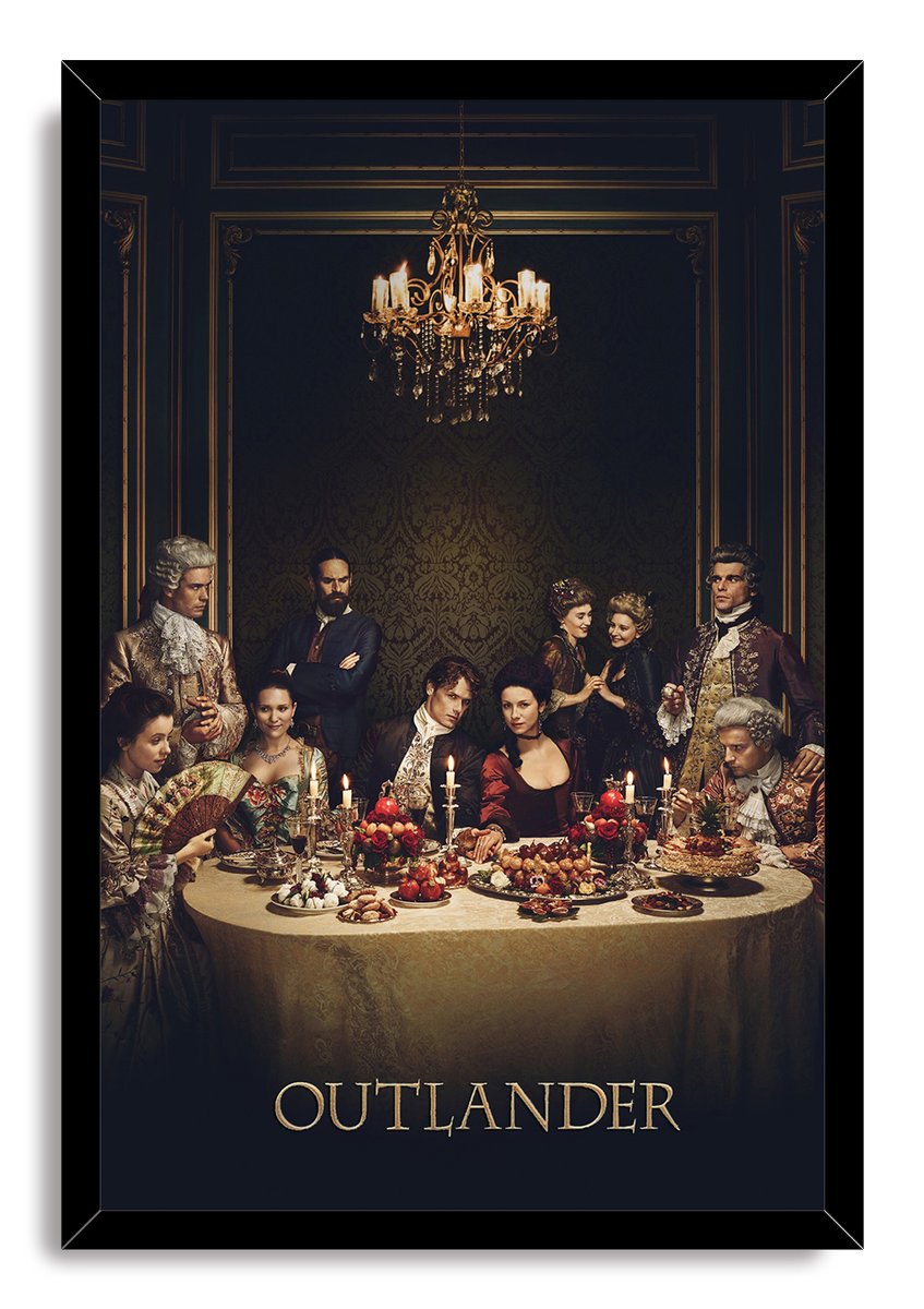 Outlander framed wall art print presents the cast at a lavish candlelit dinner, bordered by a sleek black frame.