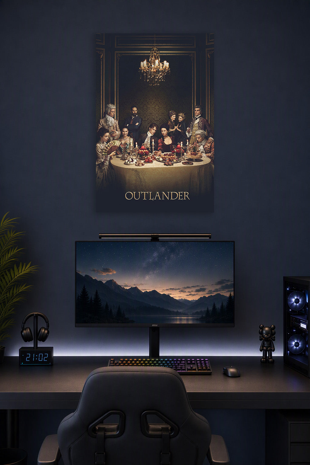 Outlander Cast Dinner Scene in a gaming desk setup above a monitor.