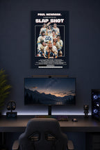 Paul Newman Slap Shot Movie in a gaming desk setup above a monitor.