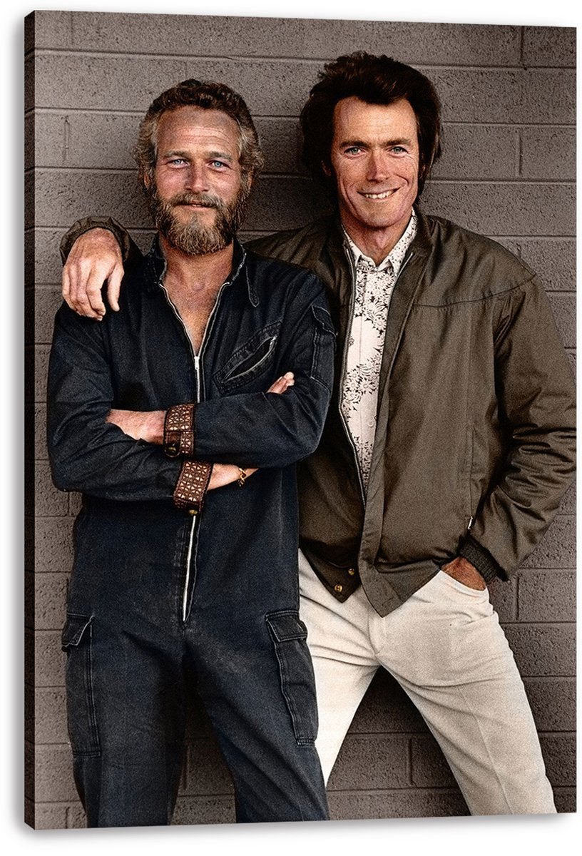 Paul Newman and Clint Eastwood canvas wall art print, a full-length portrait of the smiling actors against a gray brick wall.