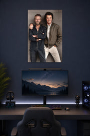 Paul Newman and Clint Eastwood in a gaming desk setup above a monitor.
