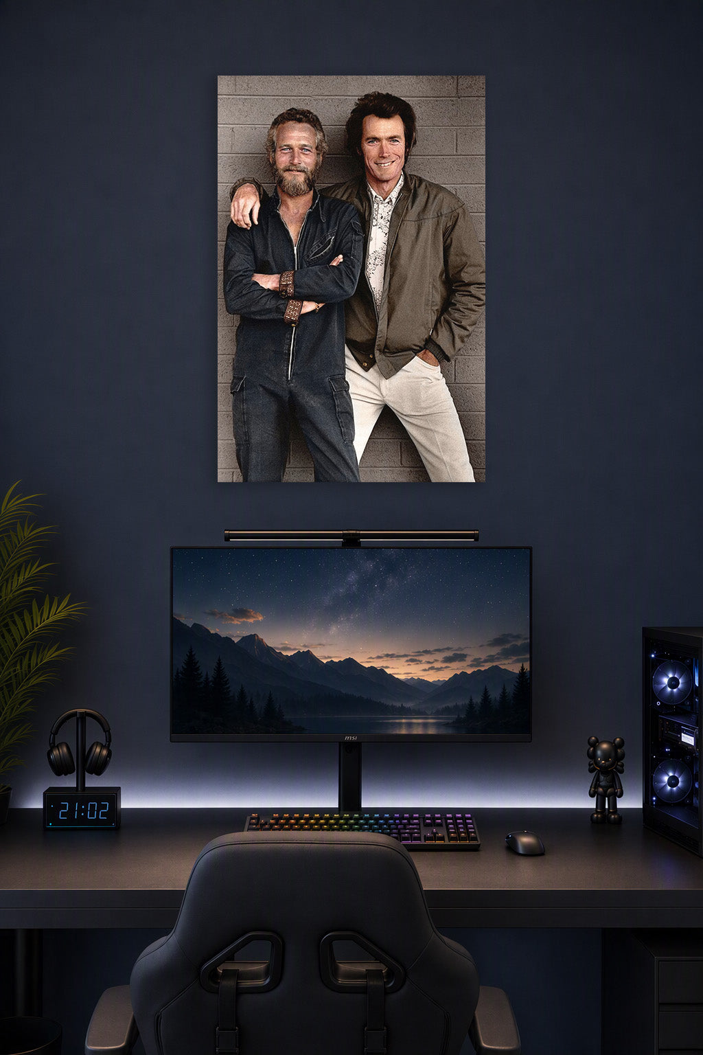 Paul Newman and Clint Eastwood in a gaming desk setup above a monitor.