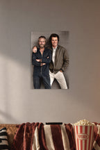 Paul Newman and Clint Eastwood in a cozy movie room above a brown sofa with popcorn.