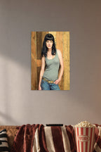 Pauley Perrette in a cozy movie room above a brown sofa with popcorn.