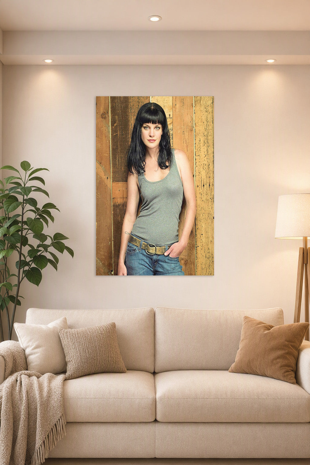 Pauley Perrette in a bright living room above a beige sofa.