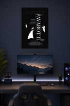 Pavarotti in a gaming desk setup above a monitor.