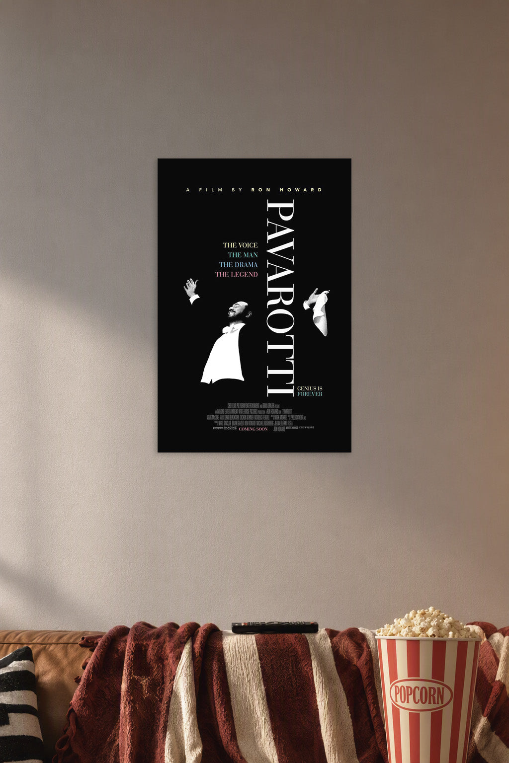 Pavarotti in a cozy movie room above a brown sofa with popcorn.
