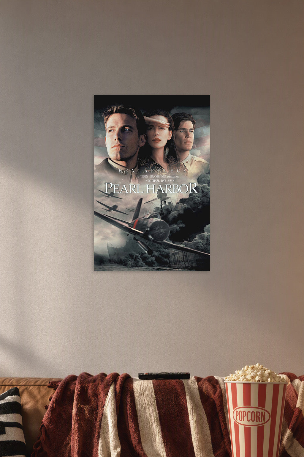 Pearl Harbor Movie Poster in a cozy movie room above a brown sofa with popcorn.