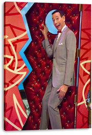 Pee-wee Herman canvas wall art print shows his playful pose in a gray suit against red geometric panels and blue trim.