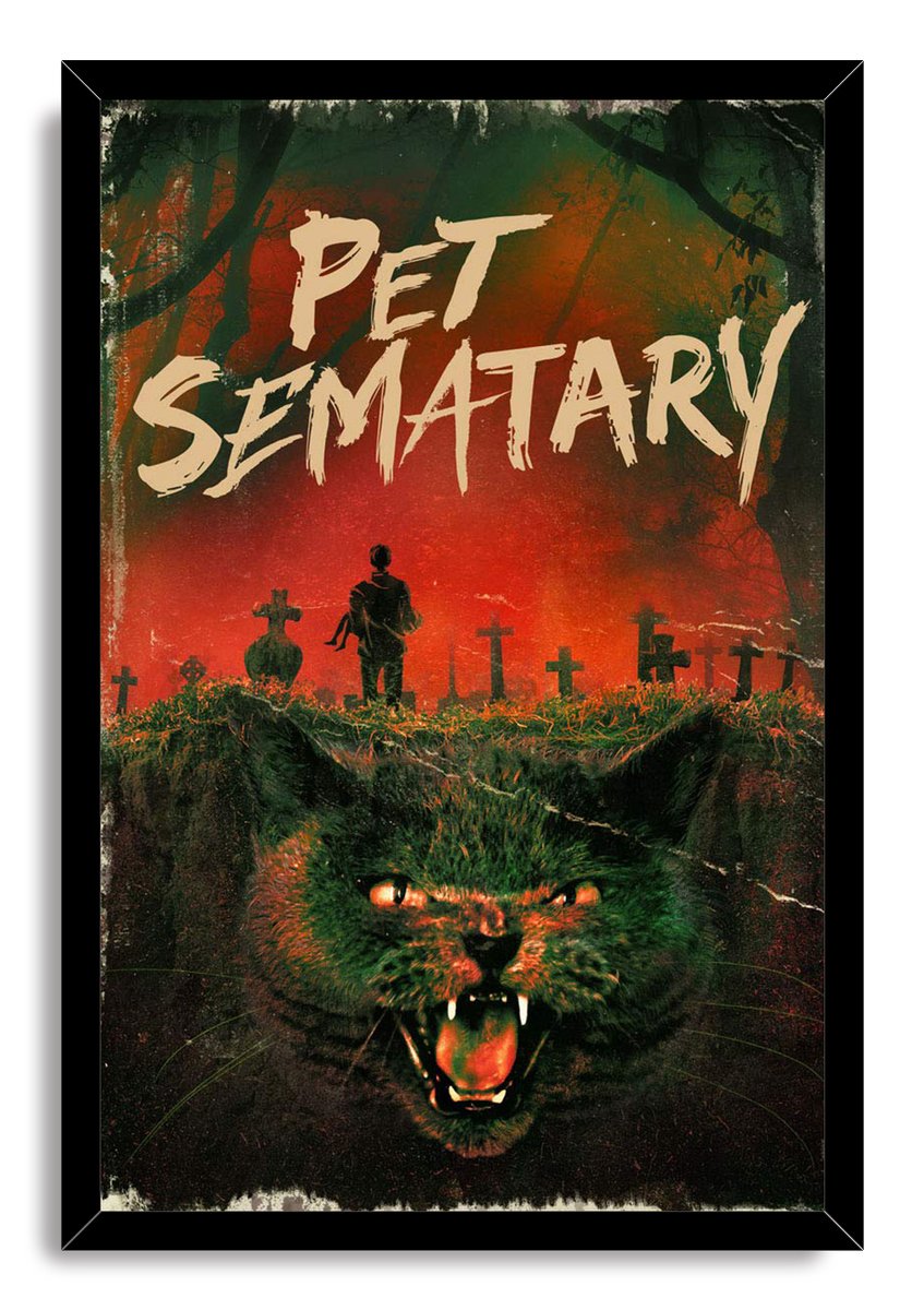 Pet Sematary framed wall art print with a snarling cat, silhouetted figure, grave markers, and a red-green woodland backdrop.