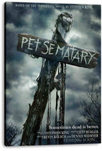 Pet Sematary canvas wall art print featuring a rustic lettered sign, hanging chains, bare trees, and a dark cloudy sky.
