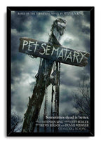 Pet Sematary framed wall art print with a black border, weathered sign, dangling chains, and storm clouds.