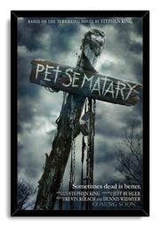 Pet Sematary framed wall art print with a black border, weathered sign, dangling chains, and storm clouds.