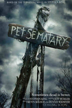 Pet Sematary movie poster wall art featuring a weathered sign on a chained wooden cross beneath stormy gray clouds.