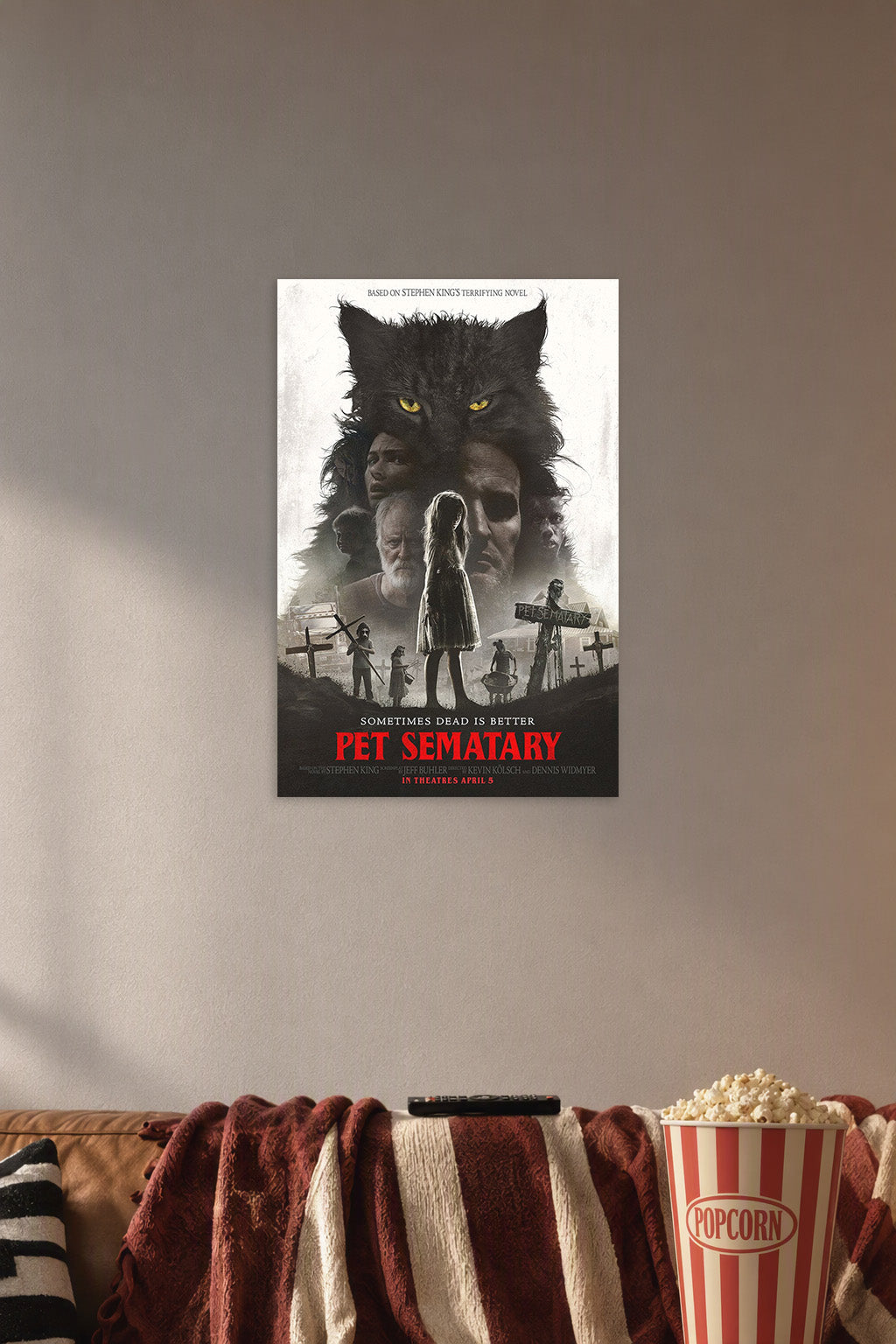 Pet Sematary Movie Poster in a cozy movie room above a brown sofa with popcorn.