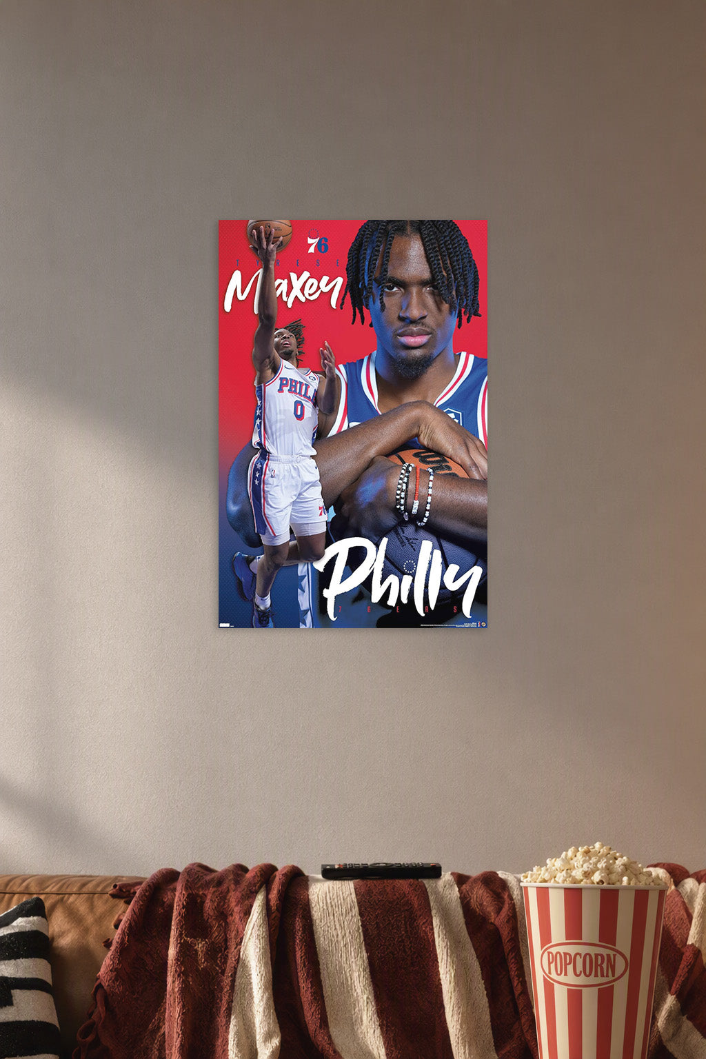 Philadelphia 76ers - Tyrese Maxey 24 NBA in a cozy movie room above a brown sofa with popcorn.