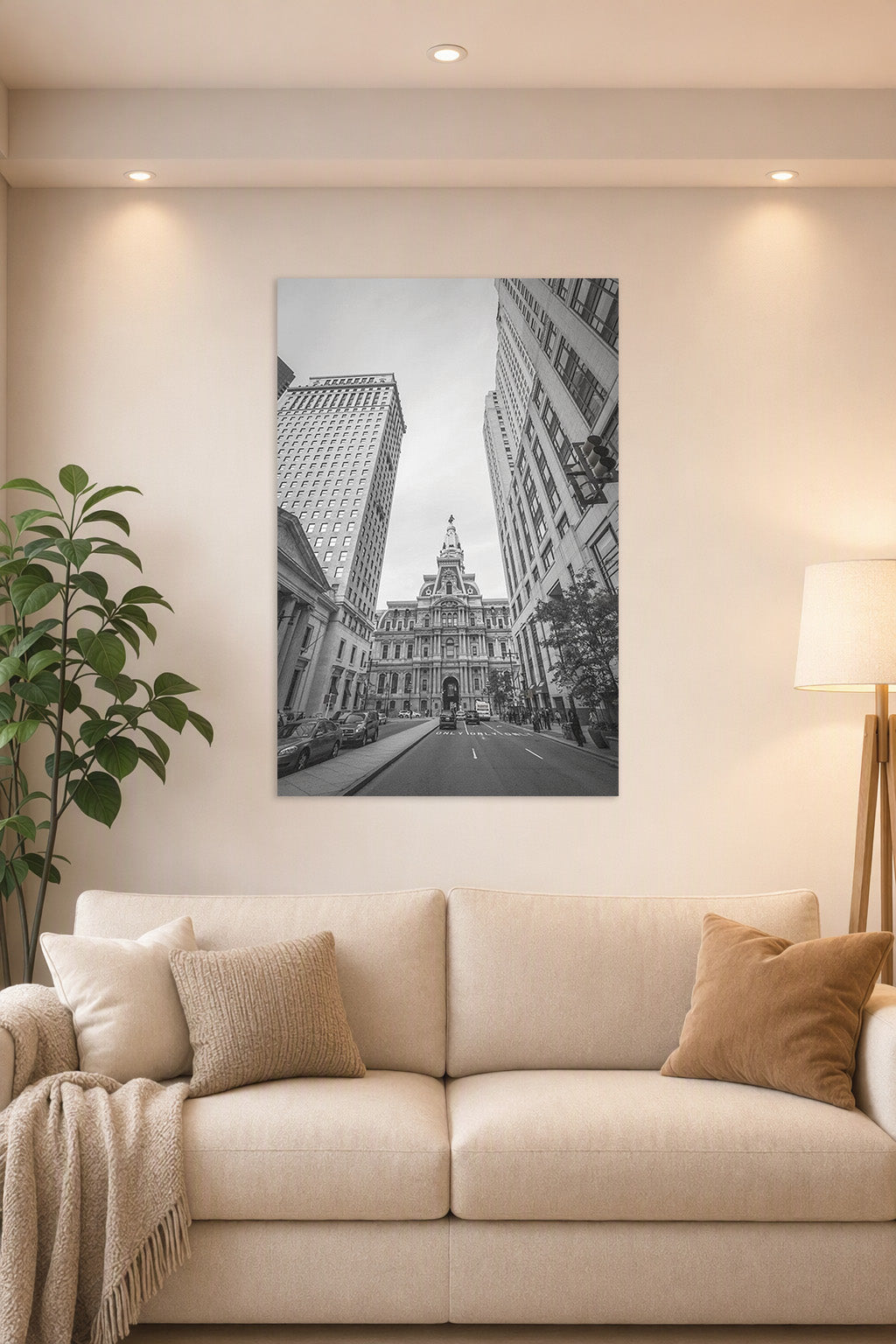 Philadelphia City Hall in a bright living room above a beige sofa.