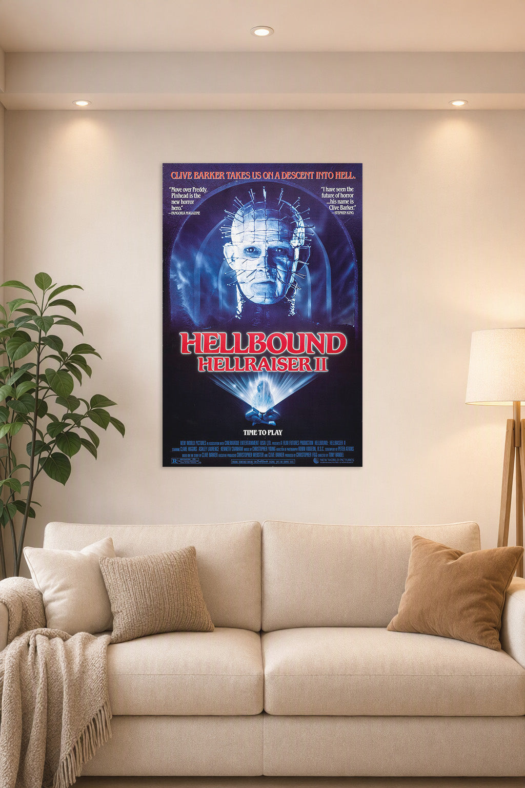 Pinhead Hellraiser II Horror Movie Poster in a bright living room above a beige sofa.