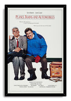 Planes, Trains and Automobiles framed wall art print with Steve Martin holding a cup beside John Candy in red mittens.