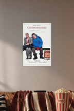 Planes, Trains & Automobiles Steve Martin John Candy in a cozy movie room above a brown sofa with popcorn.