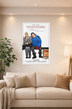 Planes, Trains & Automobiles Steve Martin John Candy in a bright living room above a beige sofa.