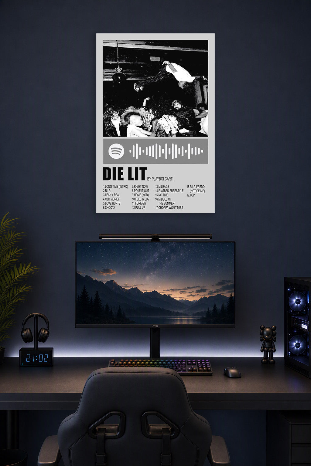 Playboi Carti Die Lit Album Art in a gaming desk setup above a monitor.