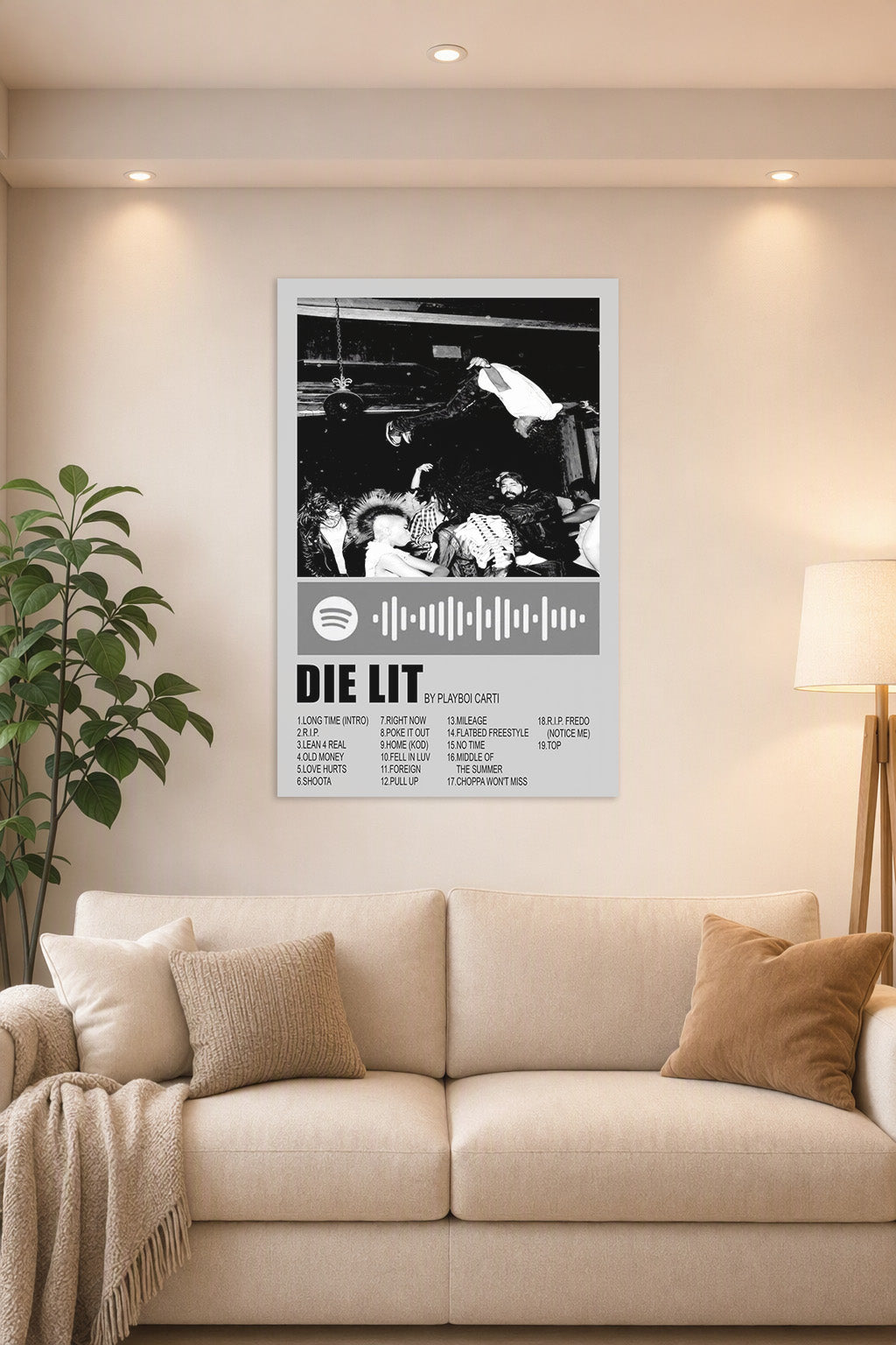 Playboi Carti Die Lit Album Art in a bright living room above a beige sofa.