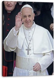 Pope Francis canvas wall art print features the smiling pontiff waving in white robes with a silver crucifix against a dark crowd.
