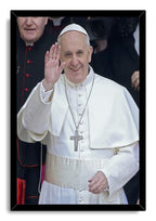 Pope Francis framed wall art print depicts the pontiff smiling and waving in white ceremonial attire, bordered by a sleek black frame.