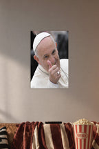 Pope Francis in a cozy movie room above a brown sofa with popcorn.