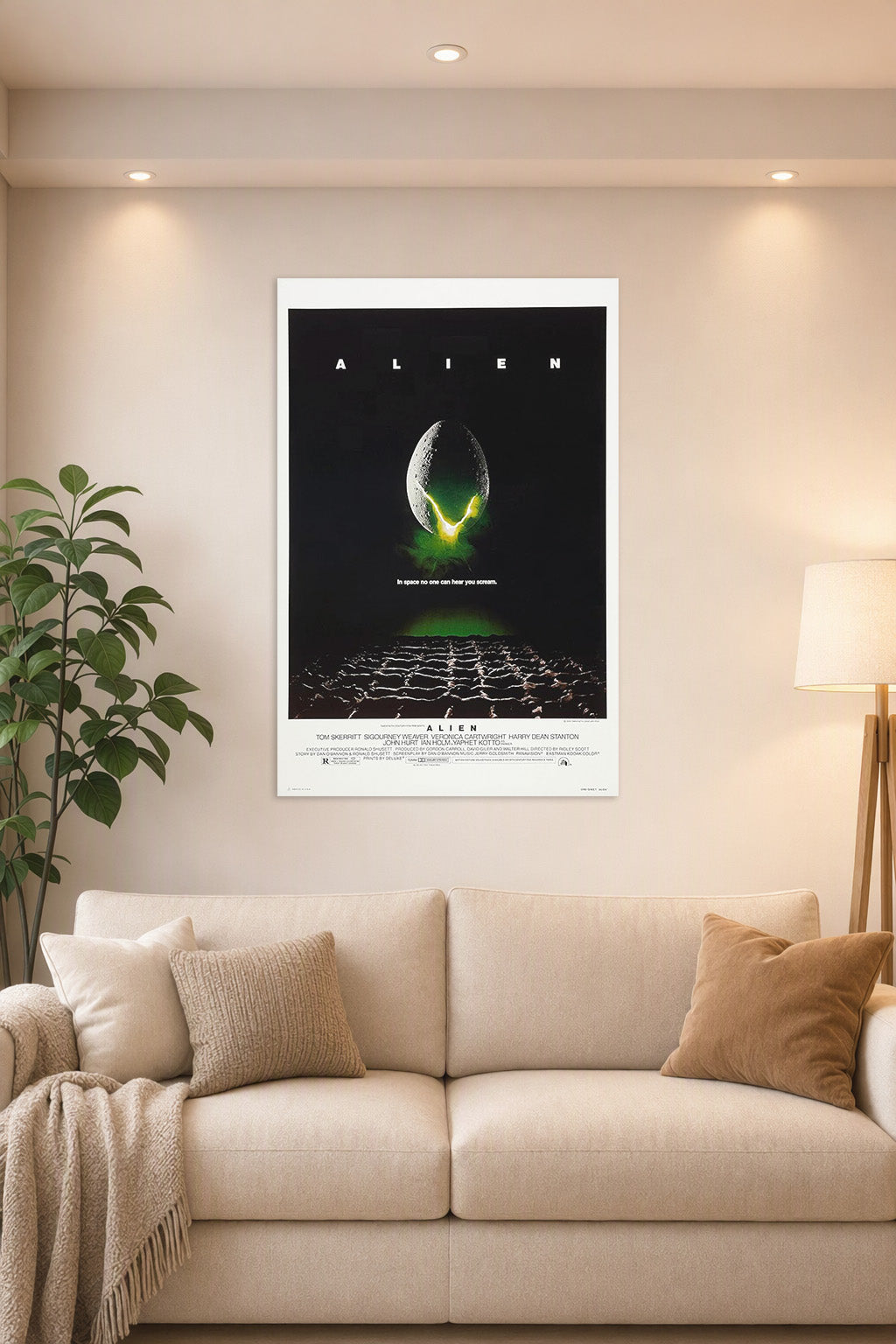 Poster Alien (1979) Movie in a bright living room above a beige sofa.