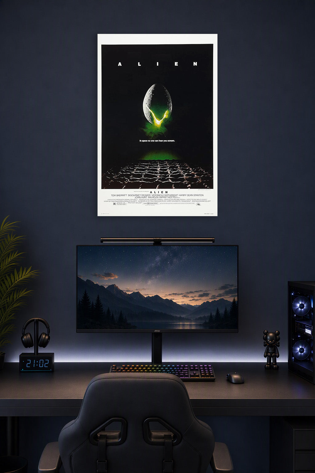 Poster Alien (1979) Movie in a gaming desk setup above a monitor.