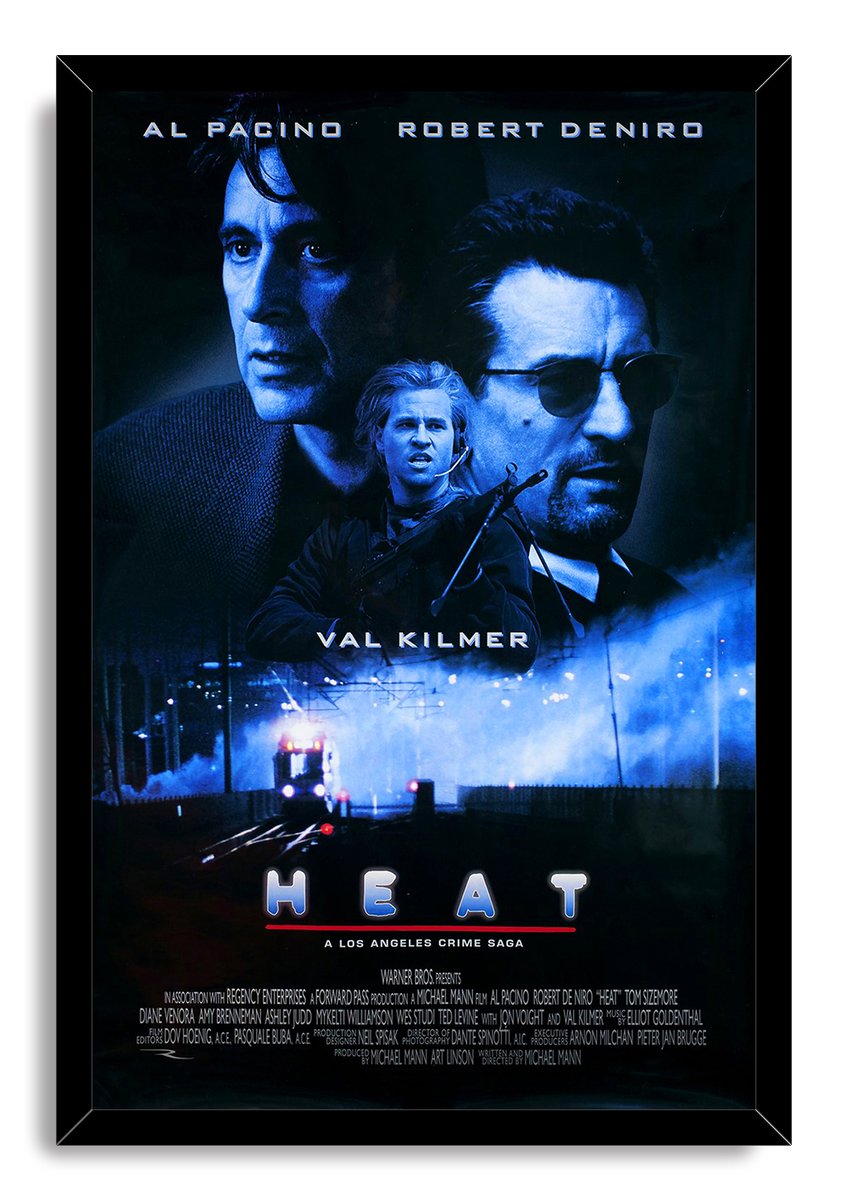 Heat movie poster framed wall art in a black frame, featuring blue character portraits, Val Kilmer with a rifle, and night train tracks.
