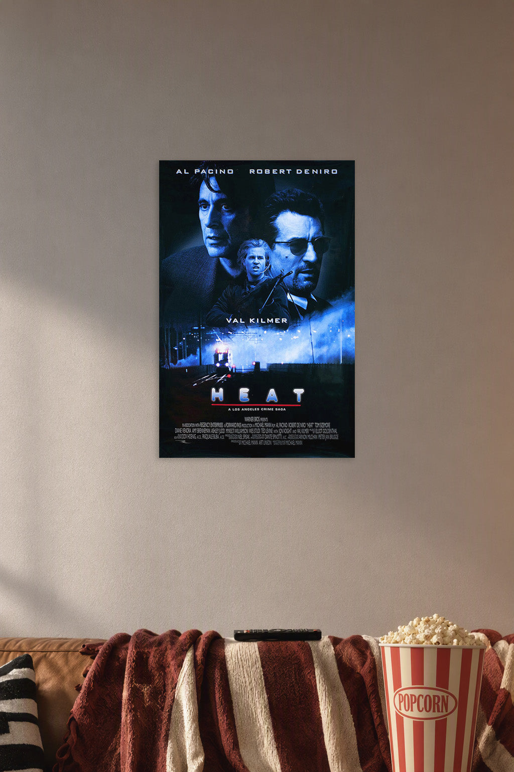 Poster Art B01N79SO3U in a cozy movie room above a brown sofa with popcorn.