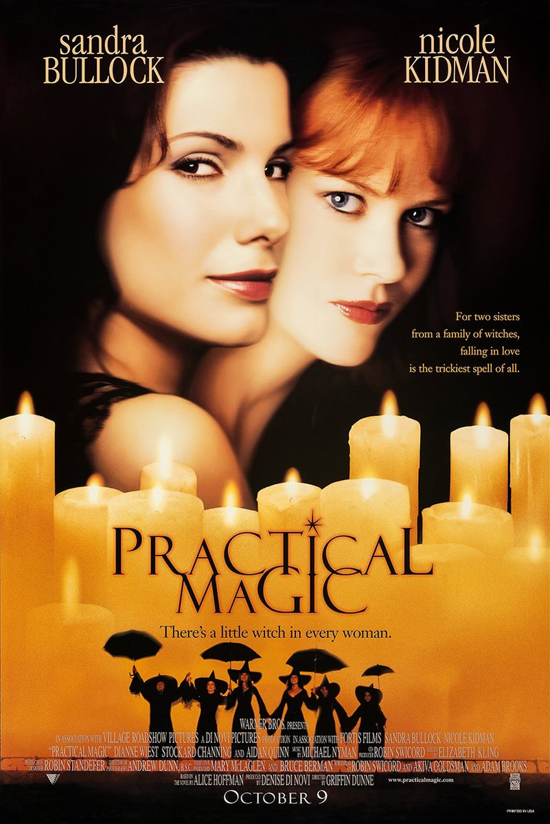 Practical Magic movie poster features close portraits of Sandra Bullock and Nicole Kidman above glowing candles and umbrella-carrying silhouettes.