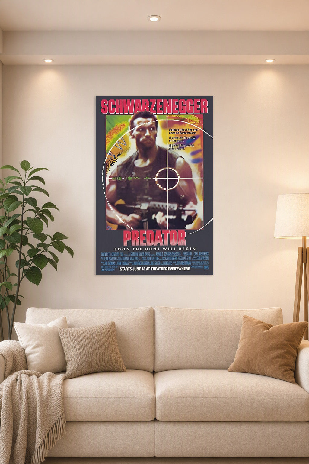 Predator (1987) Movie Poster in a bright living room above a beige sofa.