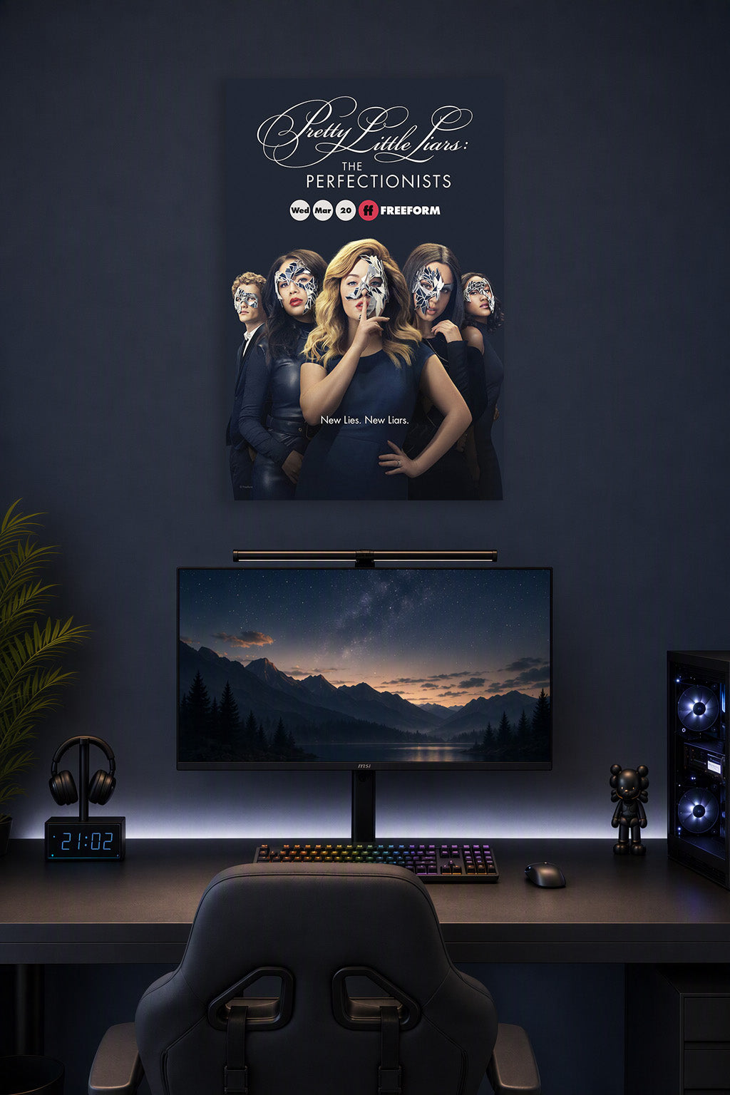 Pretty Little Liars: The Perfectionists in a gaming desk setup above a monitor.