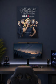 Pretty Little Liars: The Perfectionists in a gaming desk setup above a monitor.