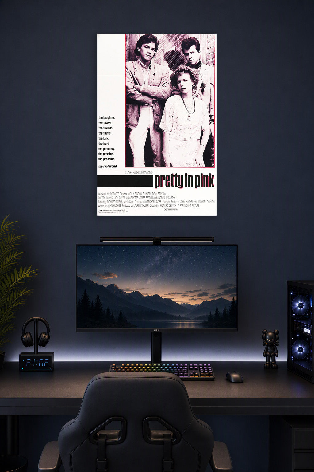 Pretty in Pink Movie in a gaming desk setup above a monitor.