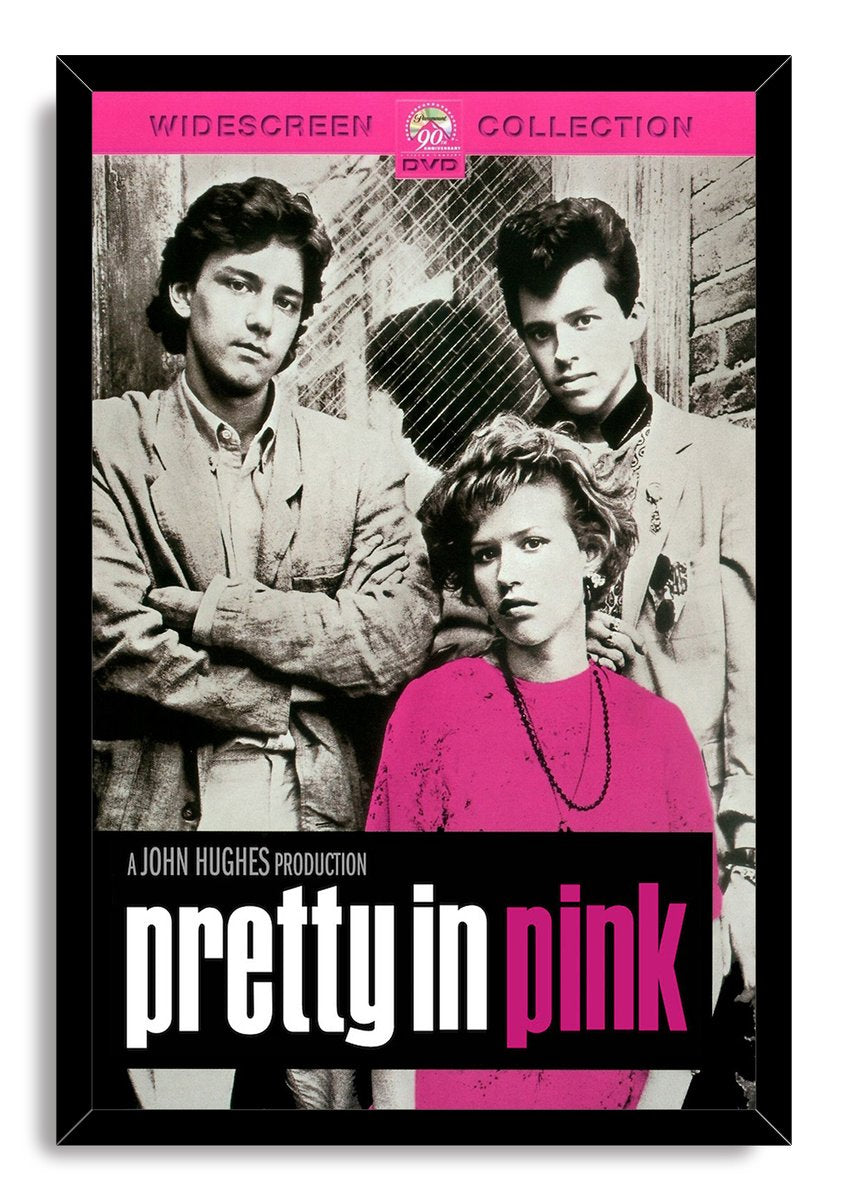 Pretty in Pink framed wall art print presents three black-and-white character portraits, a pink shirt, and oversized title text.