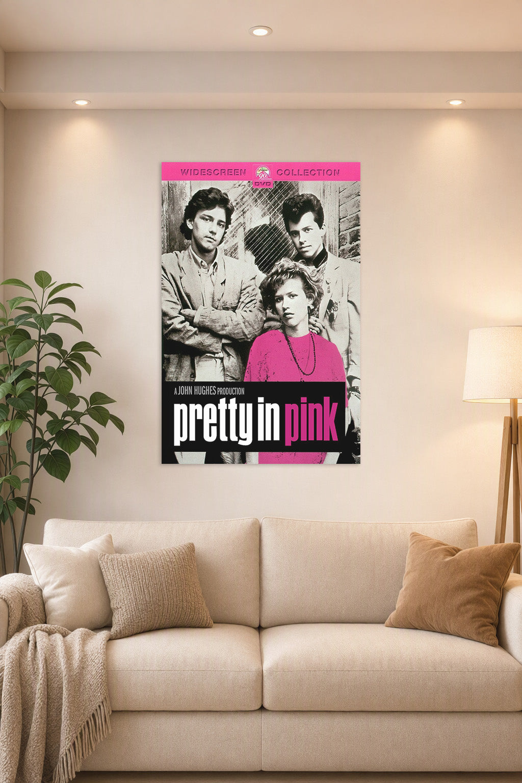 Pretty in Pink Movie Poster in a bright living room above a beige sofa.