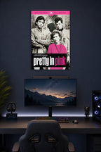 Pretty in Pink Movie Poster in a gaming desk setup above a monitor.