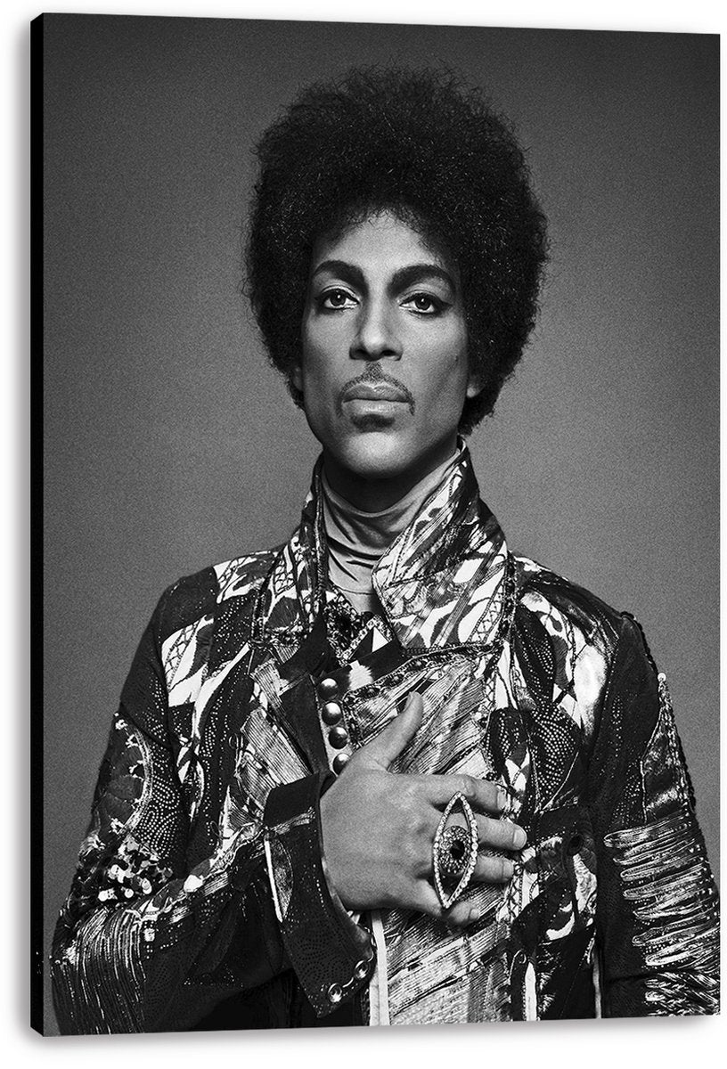 Prince canvas wall art print with a black-and-white portrait, textured patterned jacket, raised collar, and statement ring.