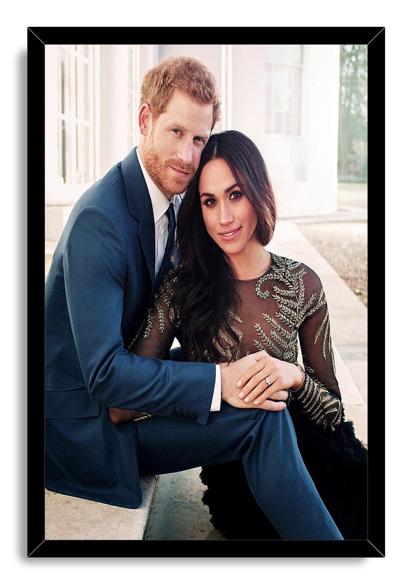 Prince Harry and Meghan Markle framed wall art print presents the couple seated closely in formal clothing within a black border.