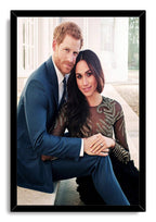 Prince Harry and Meghan Markle framed wall art print presents the couple seated closely in formal clothing within a black border.