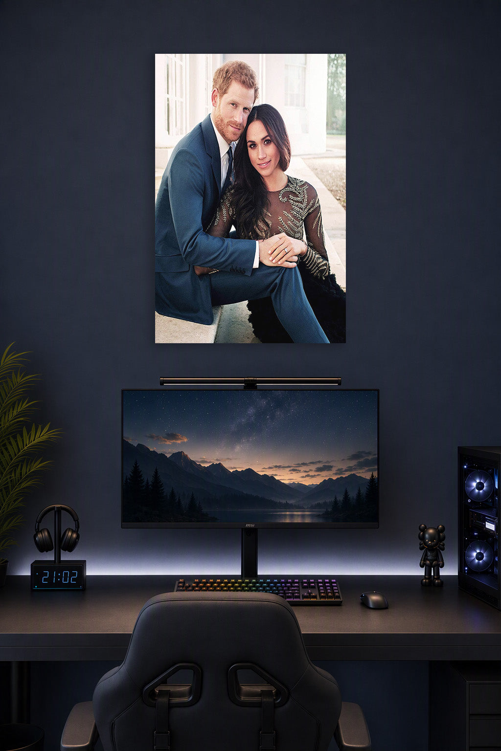 Prince Harry and Meghan Markle in a gaming desk setup above a monitor.