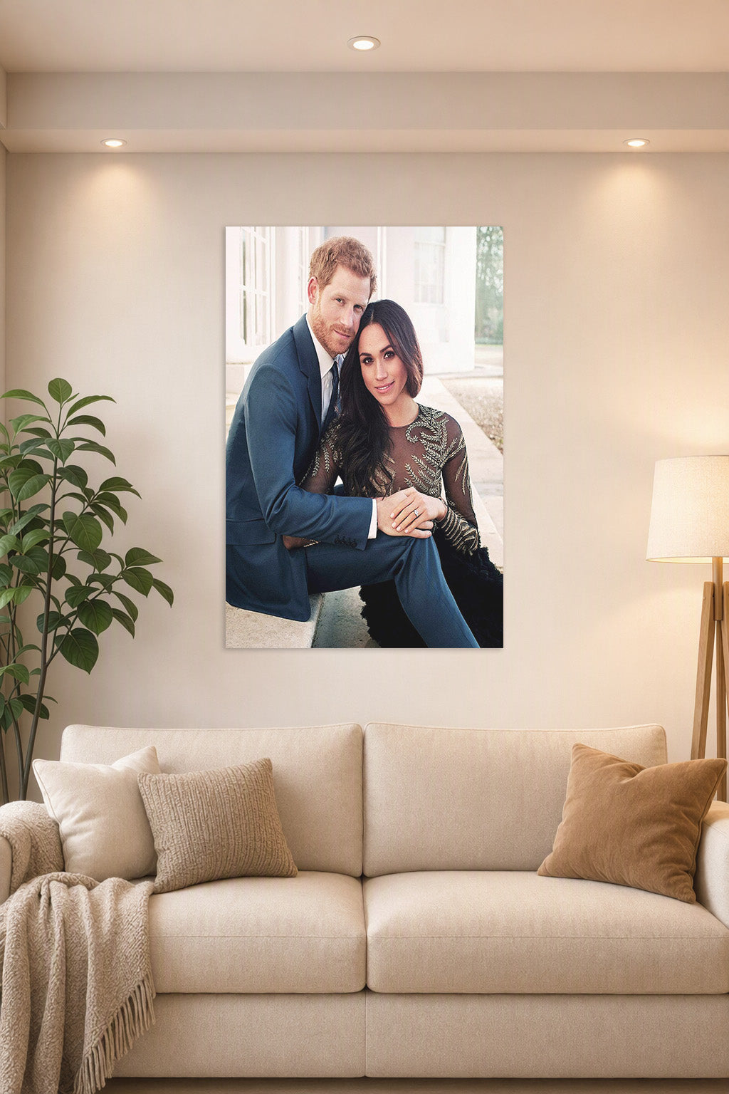 Prince Harry and Meghan Markle in a bright living room above a beige sofa.