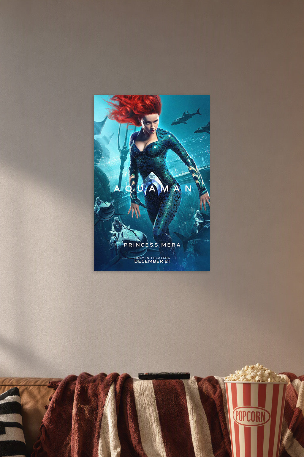 Princess Mera Aquaman Movie in a cozy movie room above a brown sofa with popcorn.