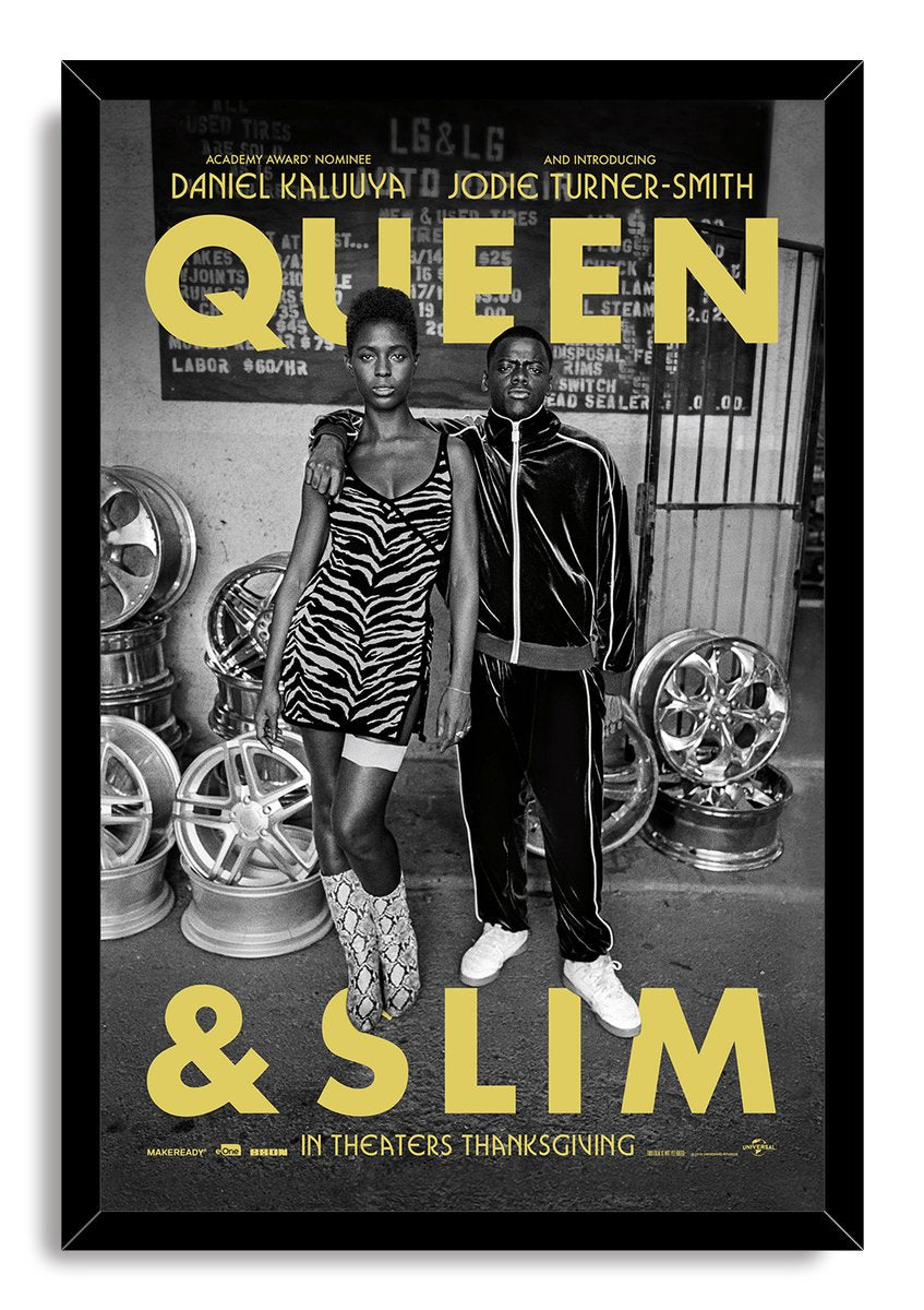 Queen & Slim framed wall art print with a black border, depicting the two leads among wheel rims and yellow typography.