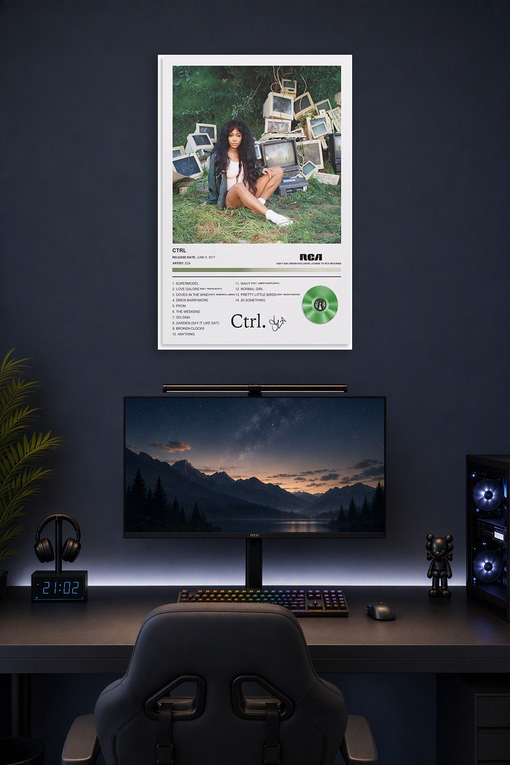 RCA Crtl Album Wall Art Poster in a gaming desk setup above a monitor.